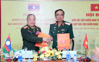  Ho Chi Minh City, Lao locality share experience in veterans’ association work